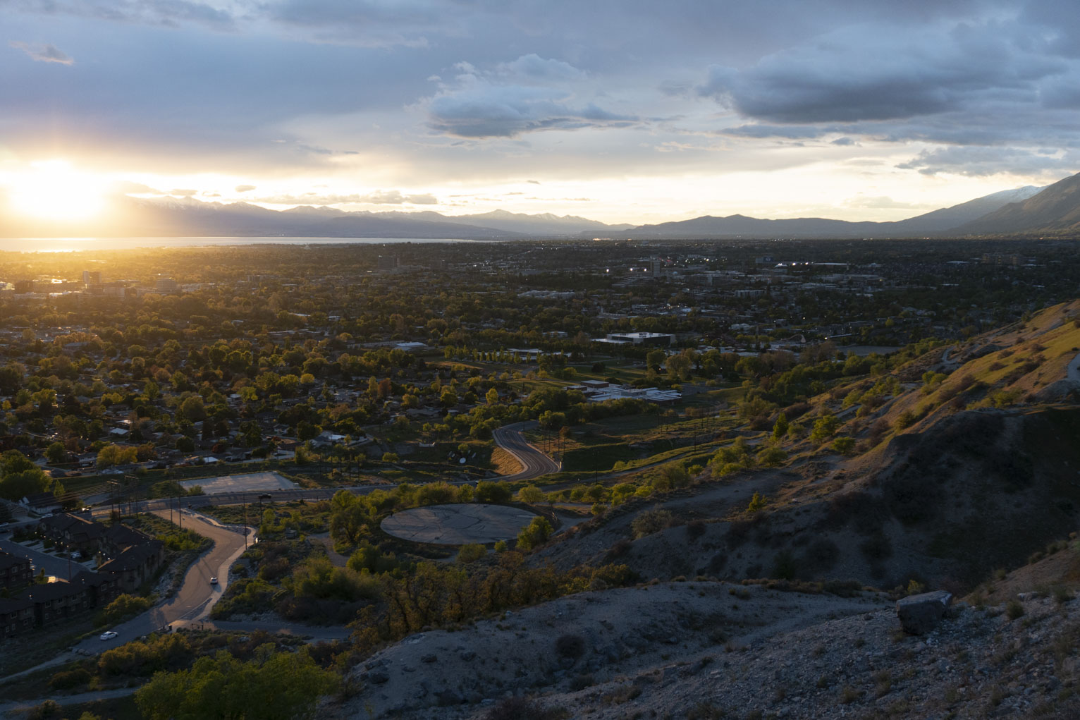 The town of Provo from the mountainside lit golden slanted